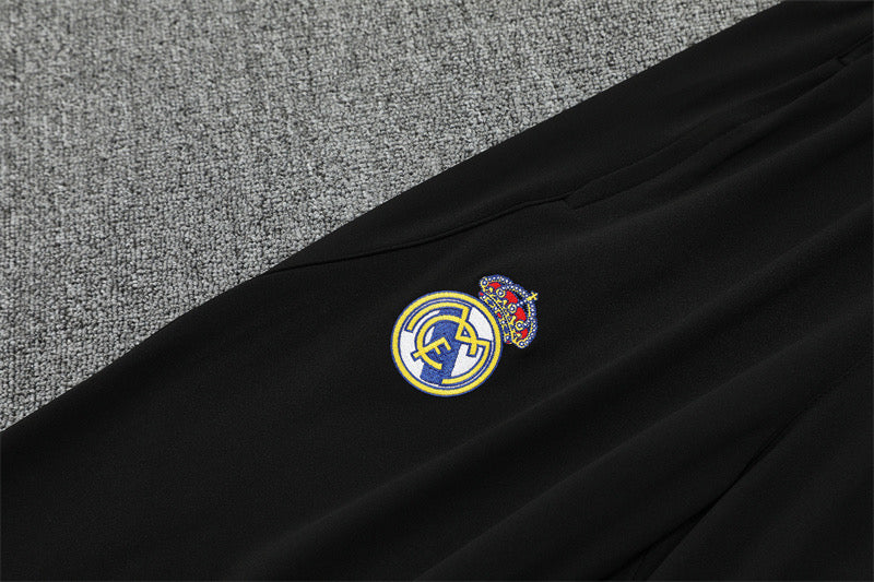 RM Marvel 25/26 Black Tracksuit featuring a yellow lightning